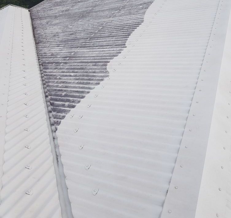 A Person is Using a High Pressure Washer to Clean a Sidewalk — Blast H2O In Bowen, QLD