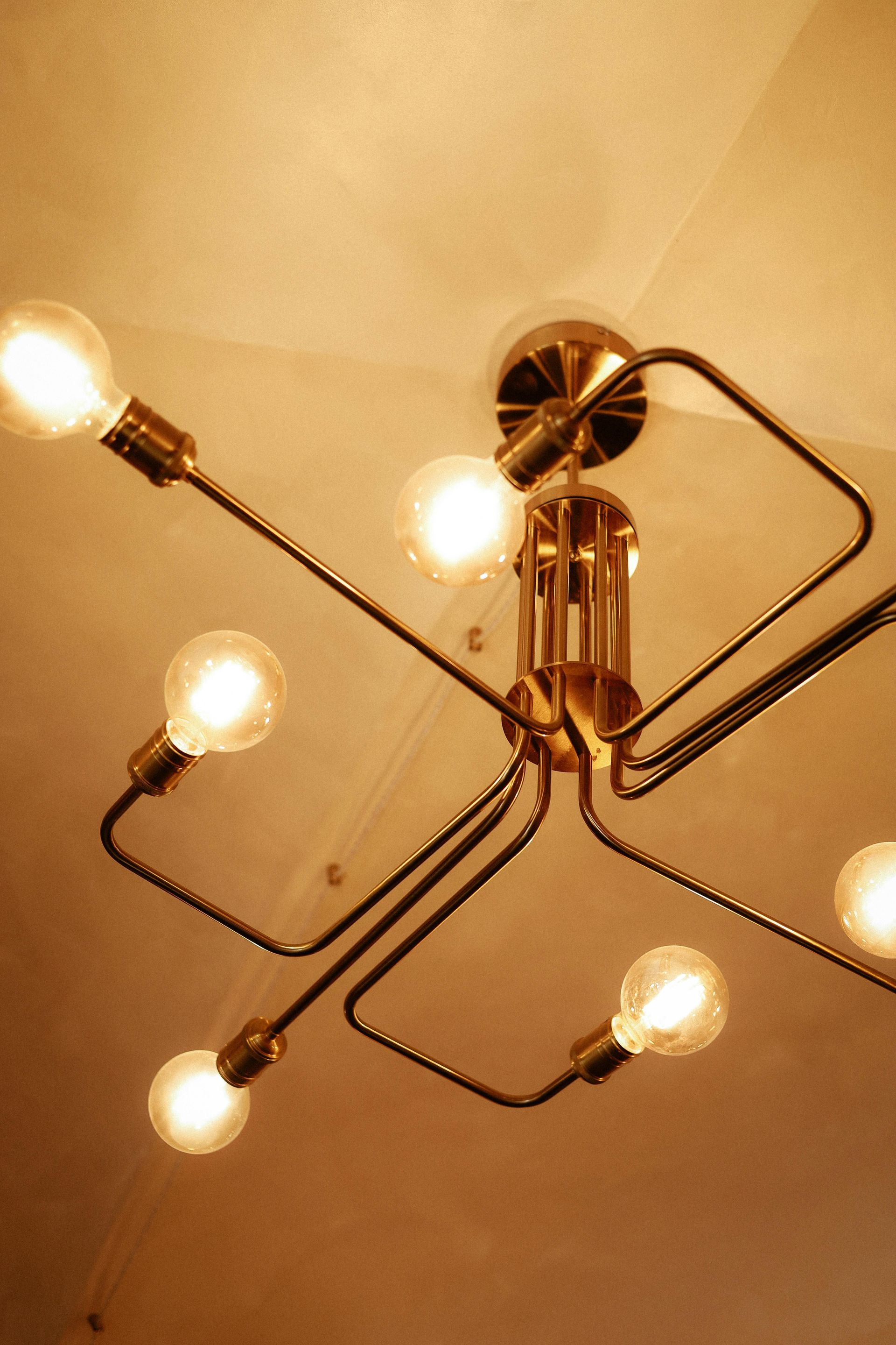 A chandelier with a lot of lights hanging from the ceiling