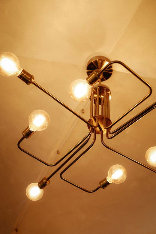 A chandelier with a lot of lights hanging from the ceiling