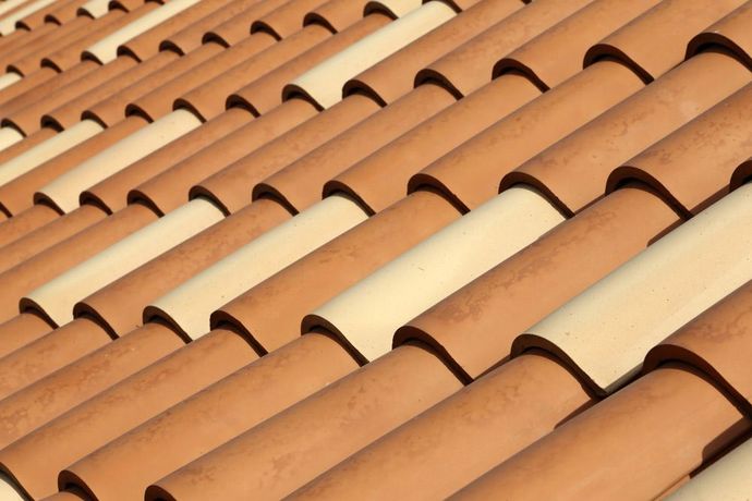 A Close Up of a Row of Tiles on a Roof — East Coast Roof Tiling Services in Kuluin, QLD