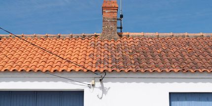 There is a Chimney on the Roof of a House — East Coast Roof Tiling Services in Kuluin, QLD