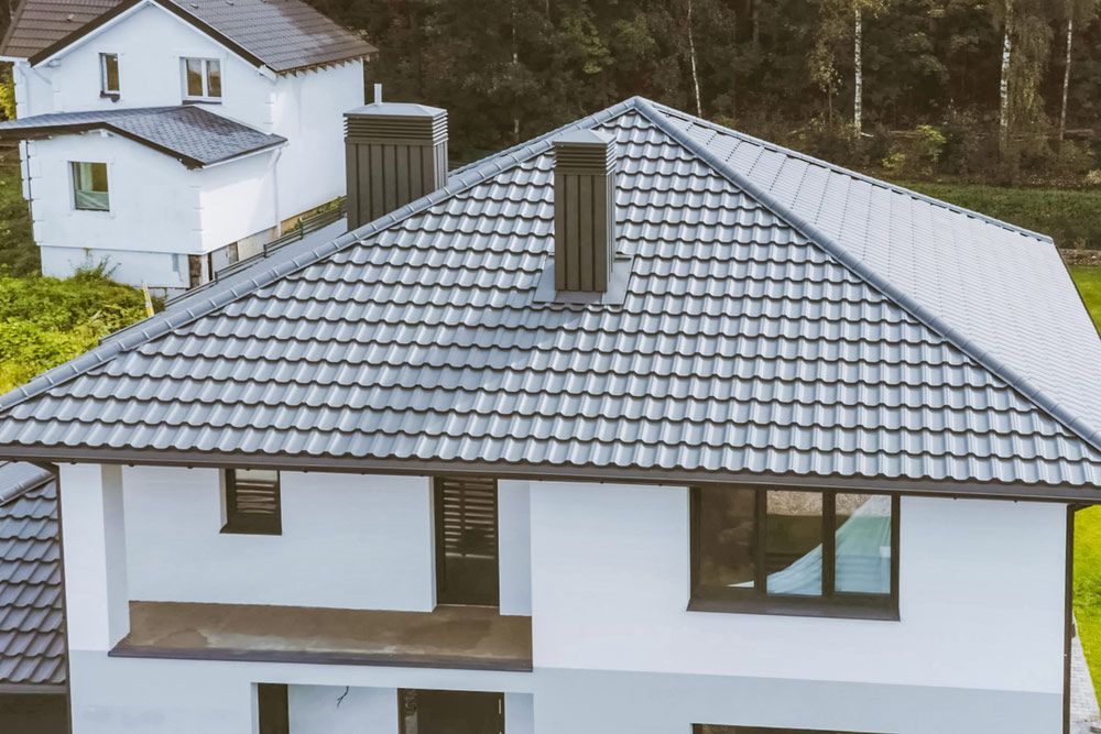 An Aerial View of a House With a Tiled Roof — East Coast Roof Tiling Services in Kuluin, QLD