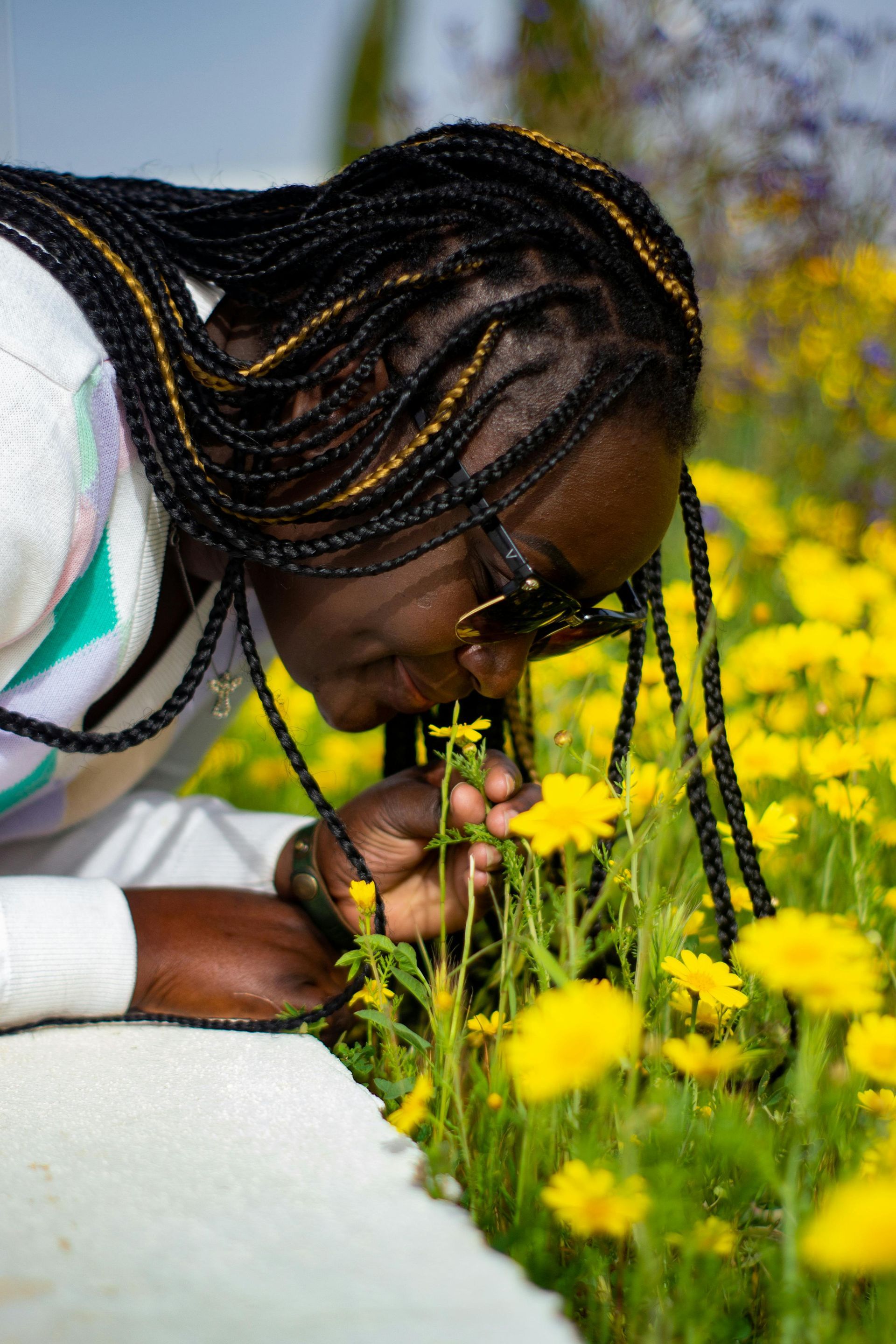 person smelling flower