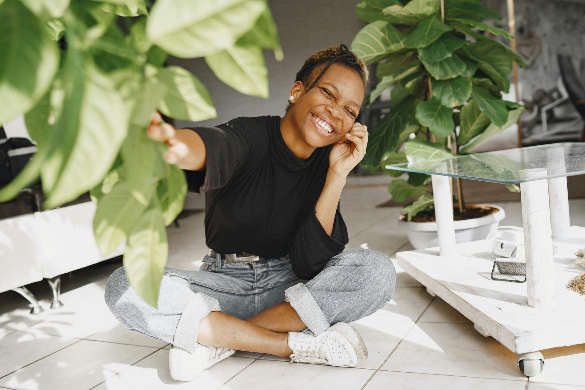 Female taking selfie around plants