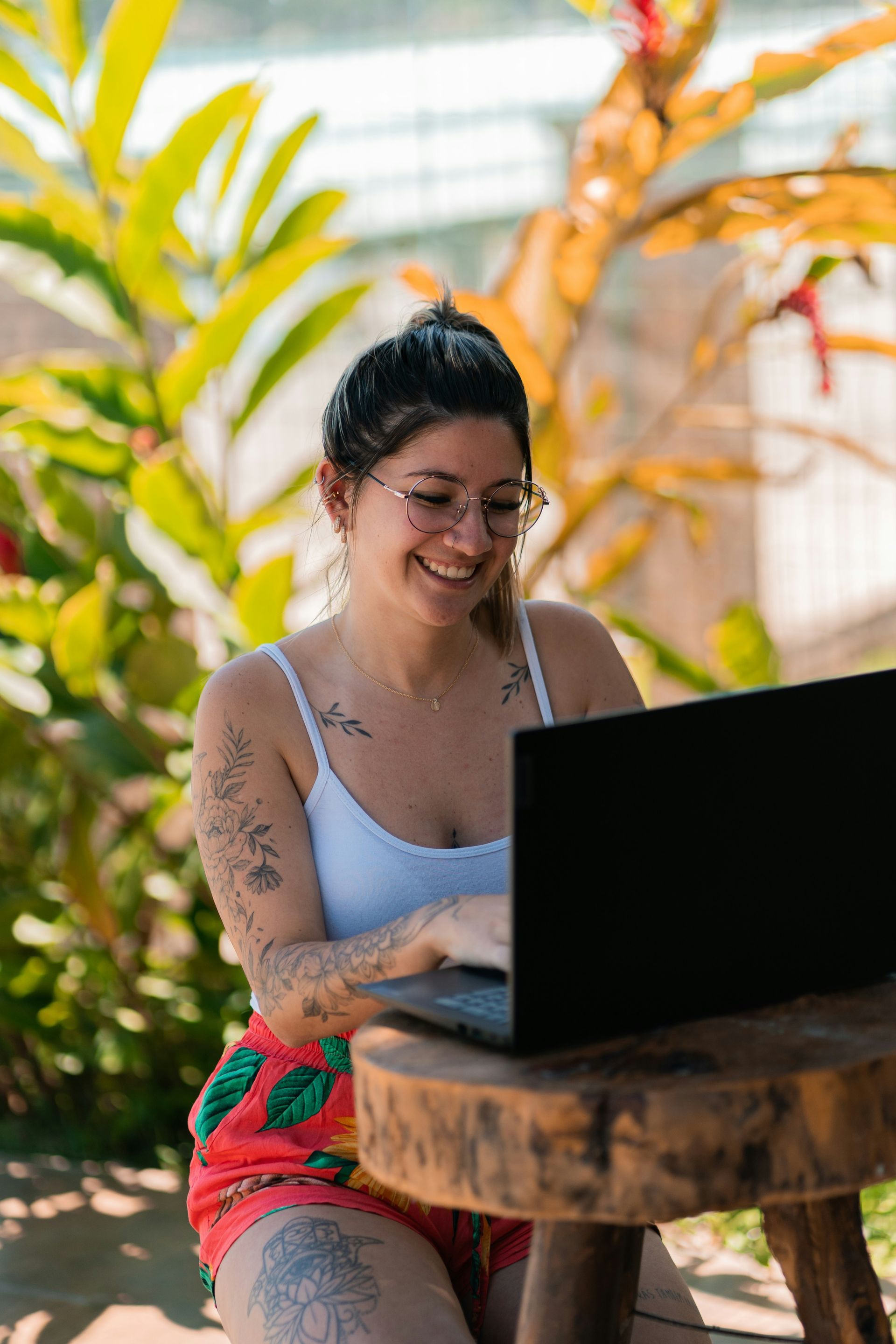 person on laptop outside