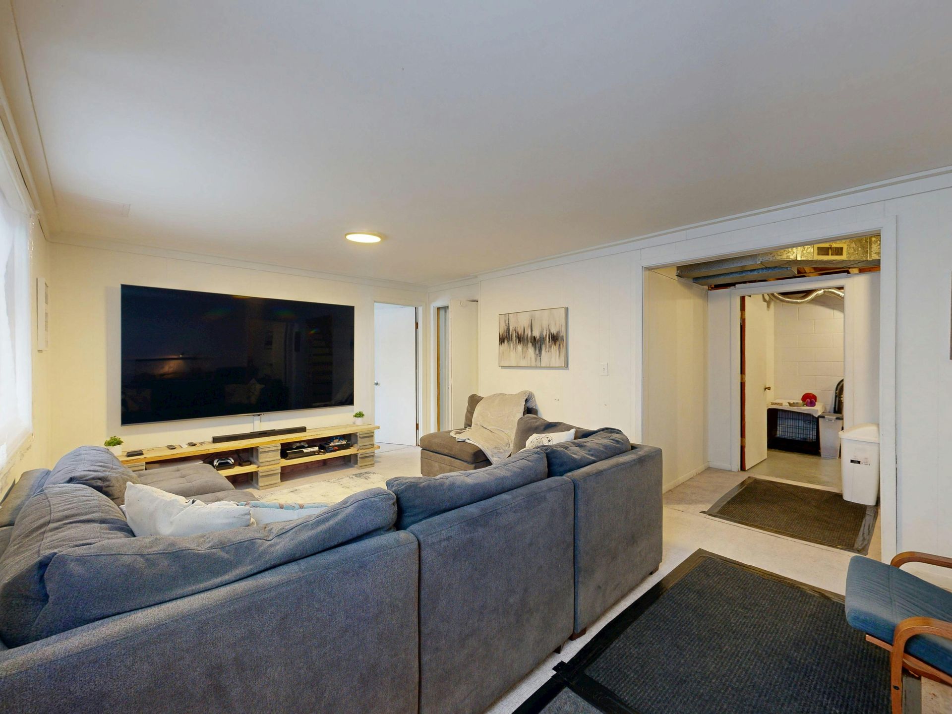Example of premium basement renovation in Michigan showing modern entertainment space