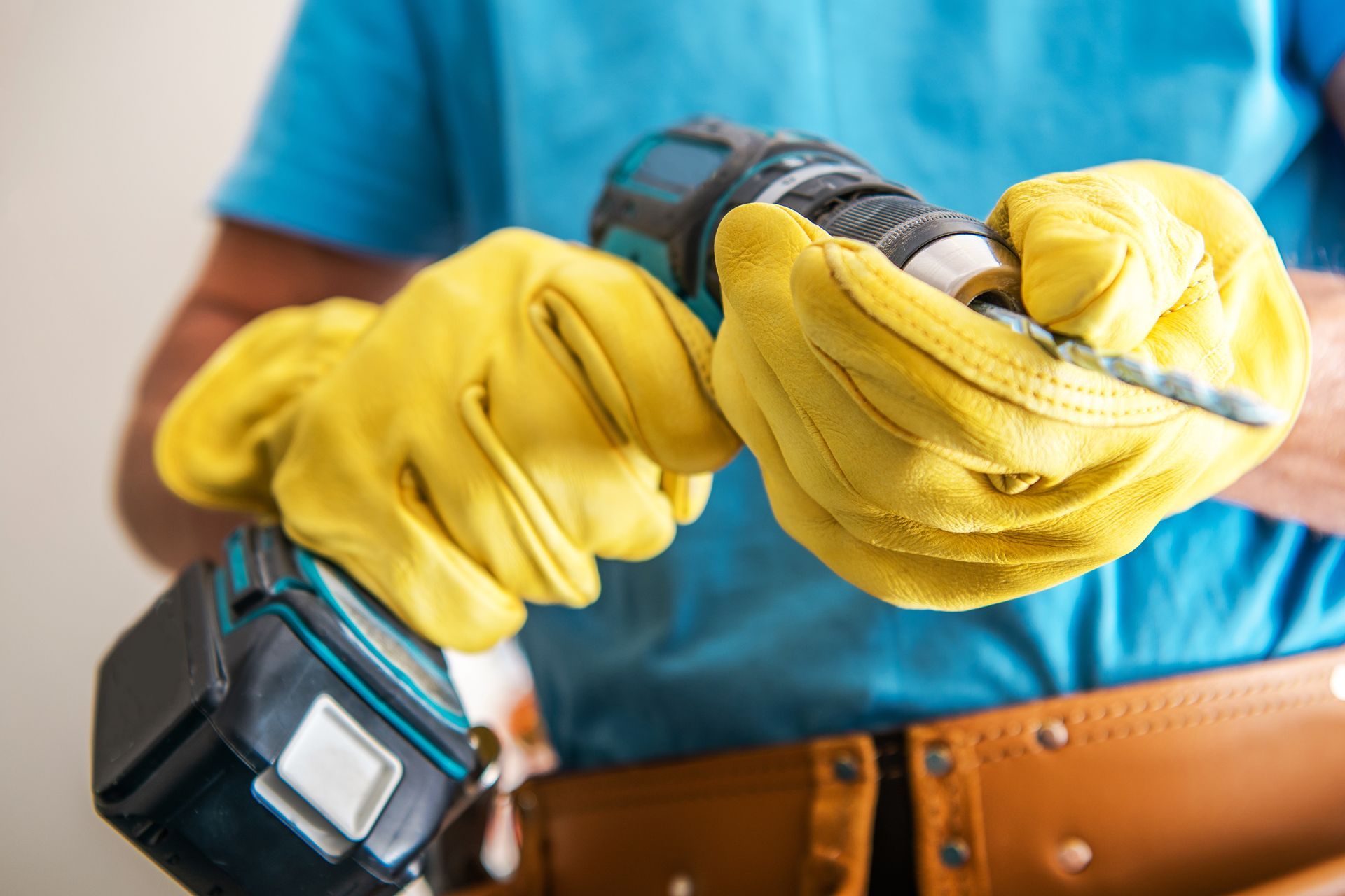handyman carrying drill for repair