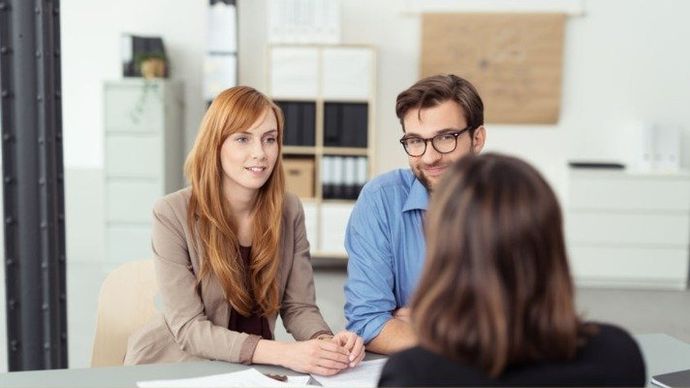 I women facing two people selling your dental practice