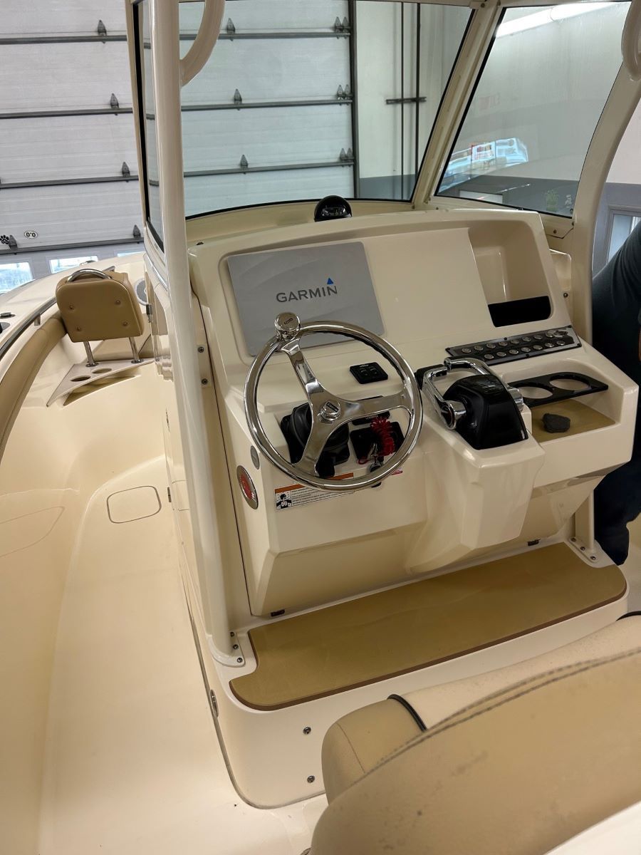 A boat with a steering wheel that says garmin on it