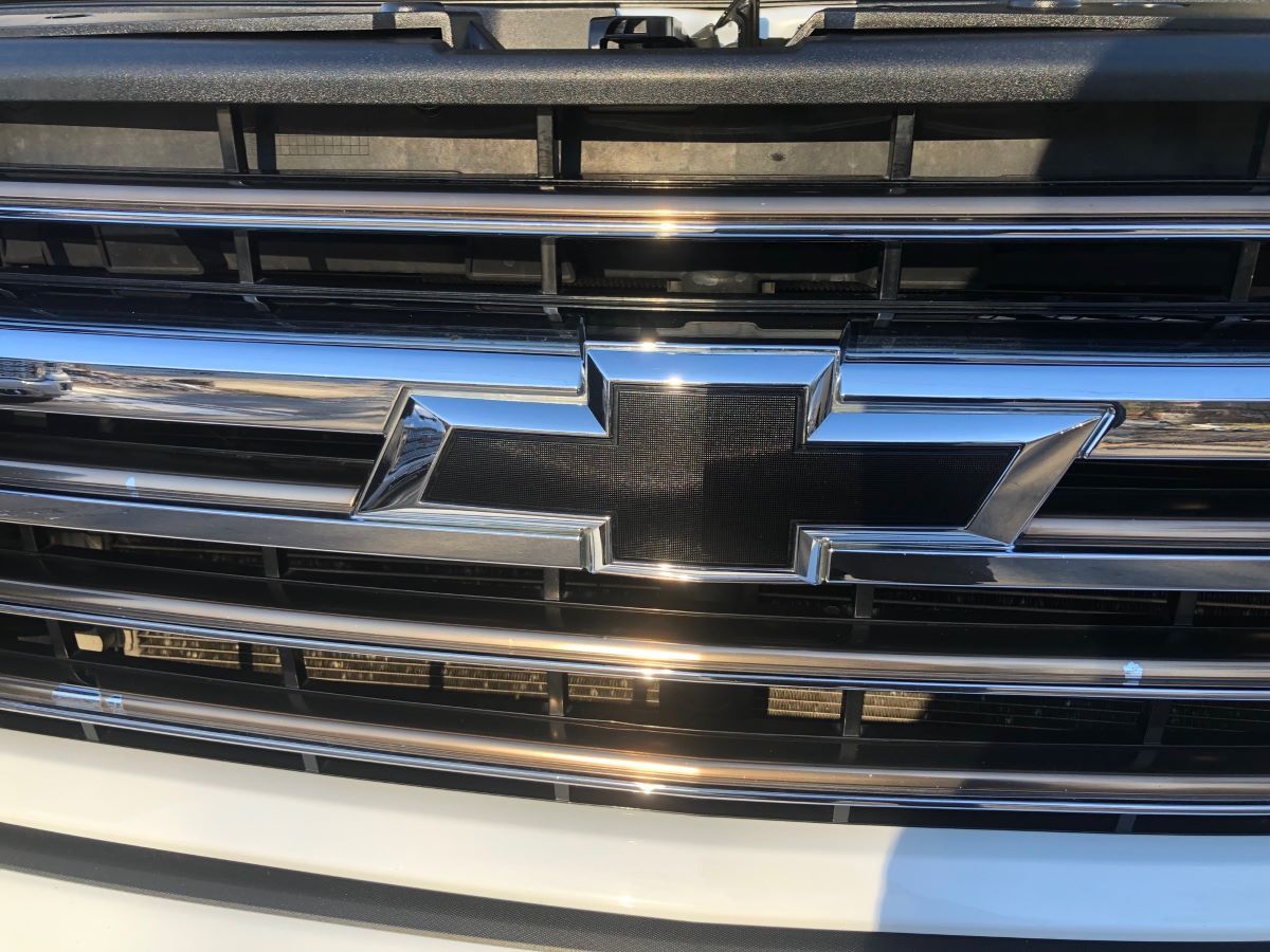 A close up of the front grille of a chevrolet truck