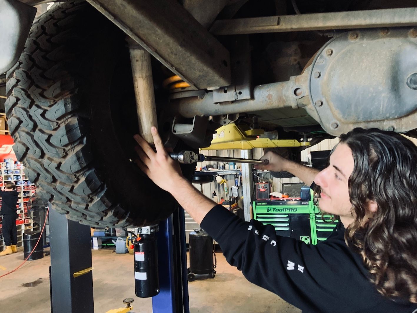 Mechanic Working On Suspension System— H.M. Mechanical in Drayton, QLD