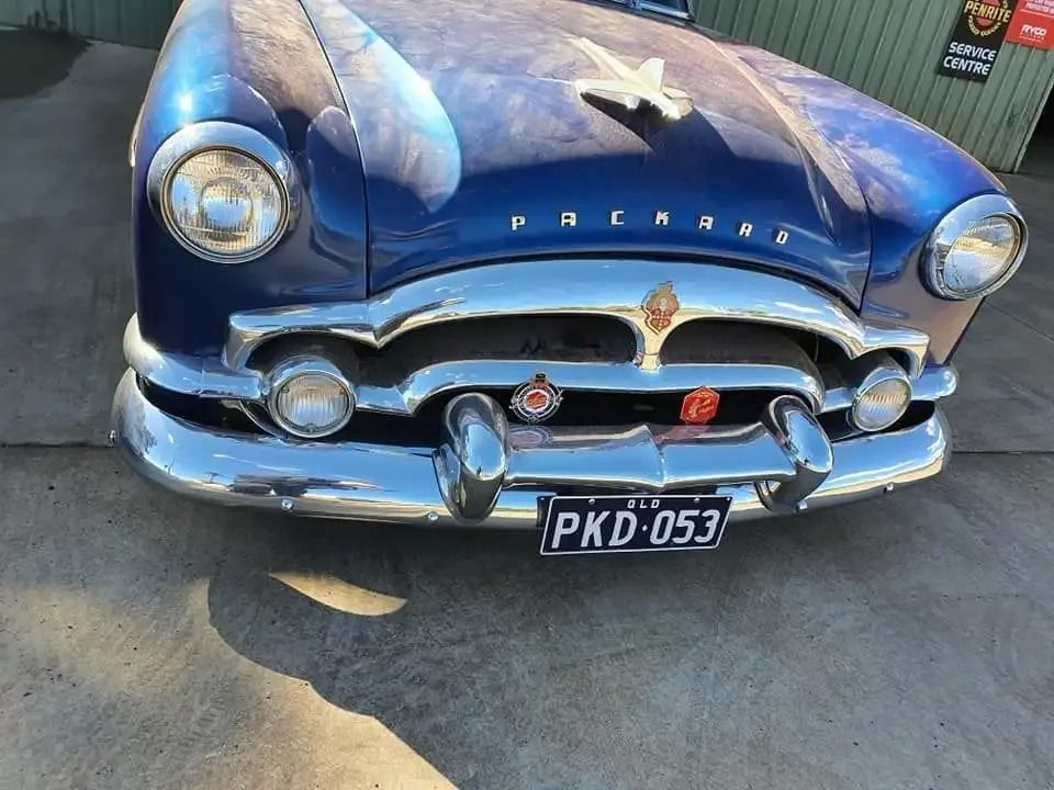 A Blue Car With a License Plate That Says Pkd 053 in Mechanic Shop — H.M. Mechanical in Cambooya, QLD