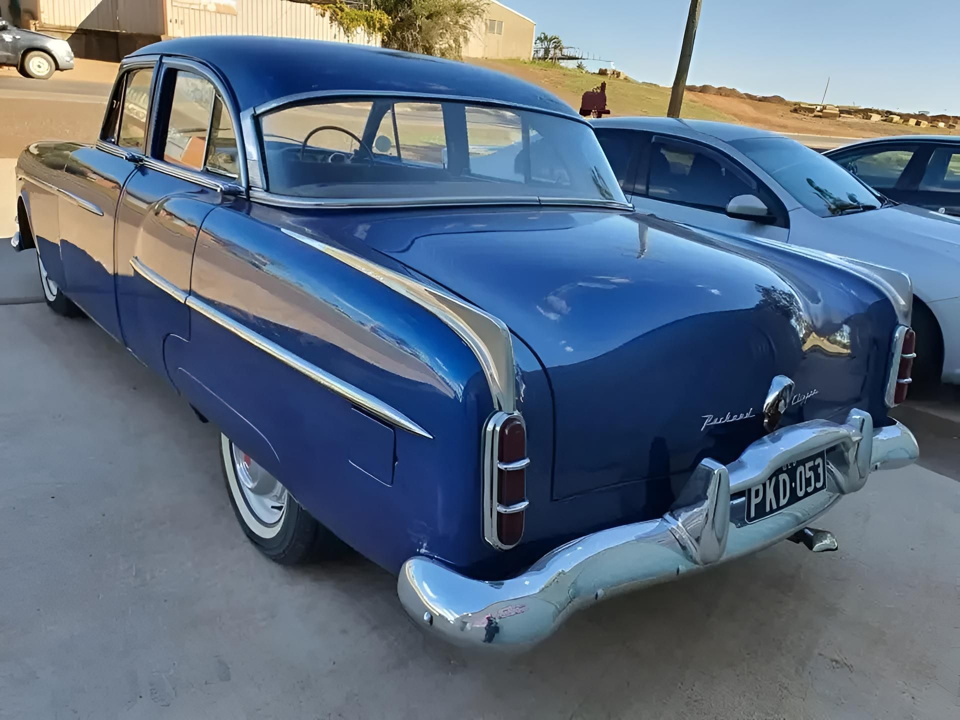 A Blue Car With a License Plate That Says Palmer in a Mechanic Shop — H.M. Mechanical in Drayton, QLD