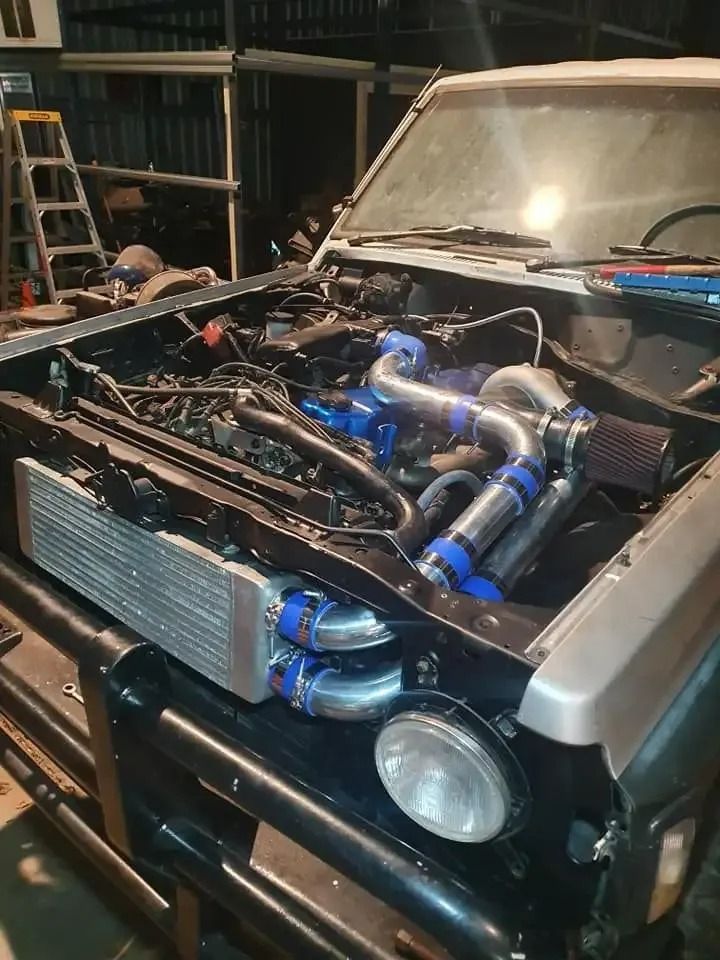 A Car With the Hood Open is Being Worked on in a Garage — H.M. Mechanical in Kingsthorpe, QLD