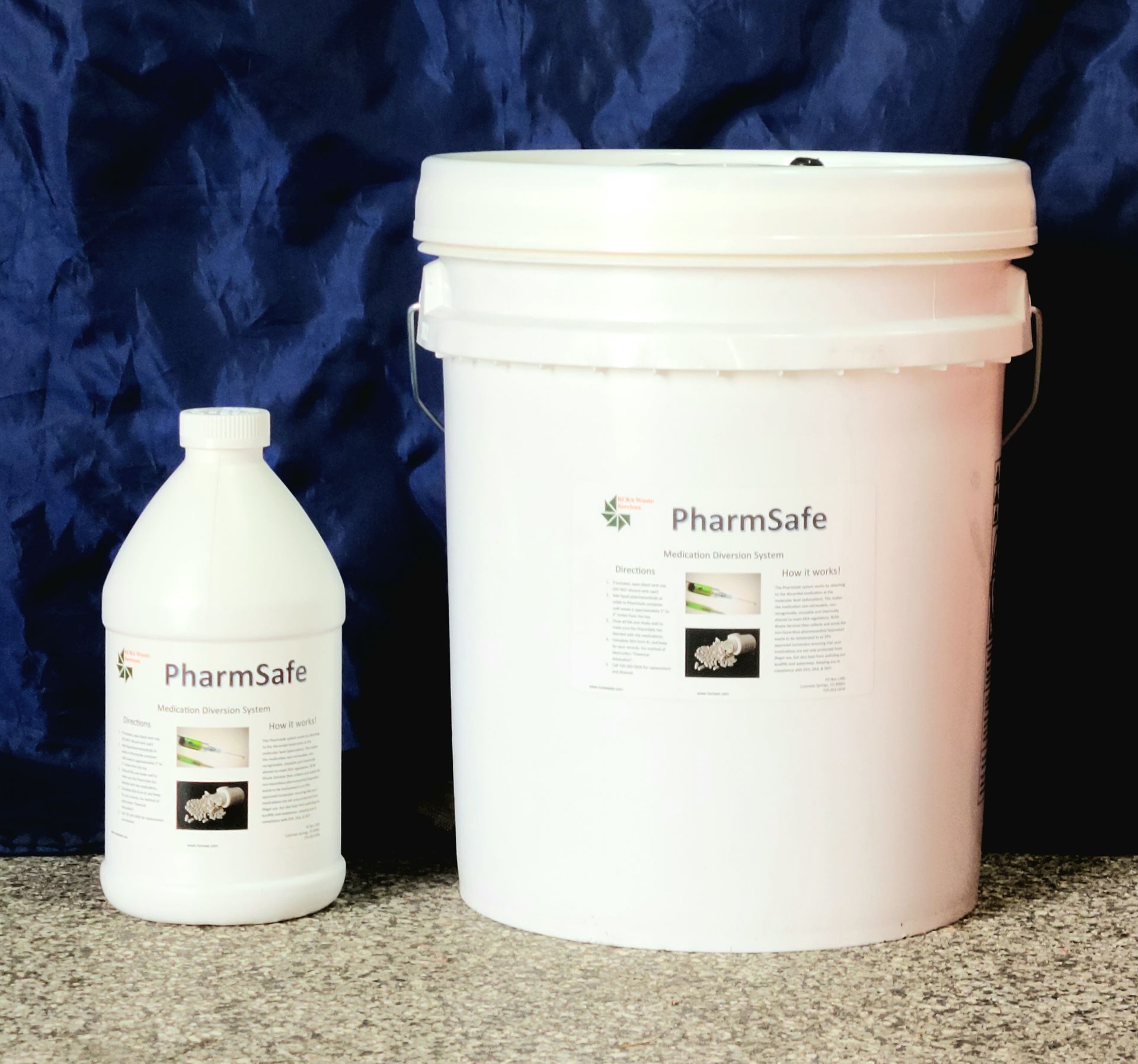 A bottle of pharmasafe sits next to a bucket