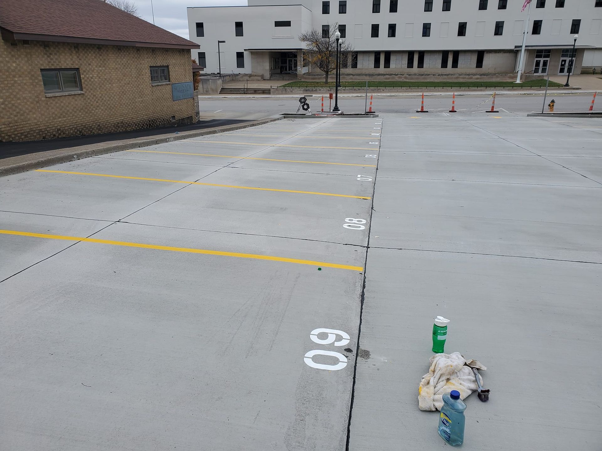A concrete parking lot with the number 60 painted on it.