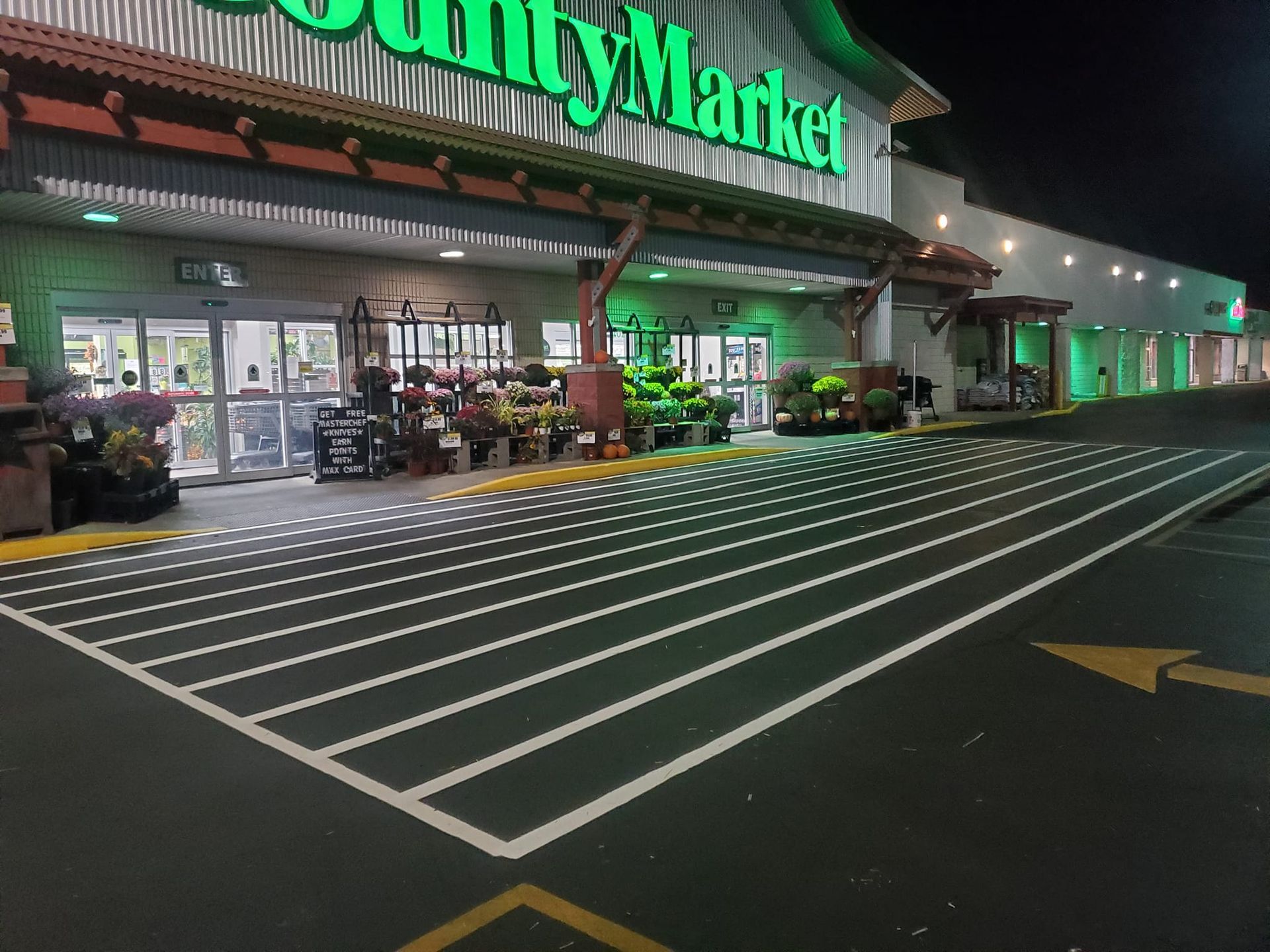 A parking lot in front of a utility market