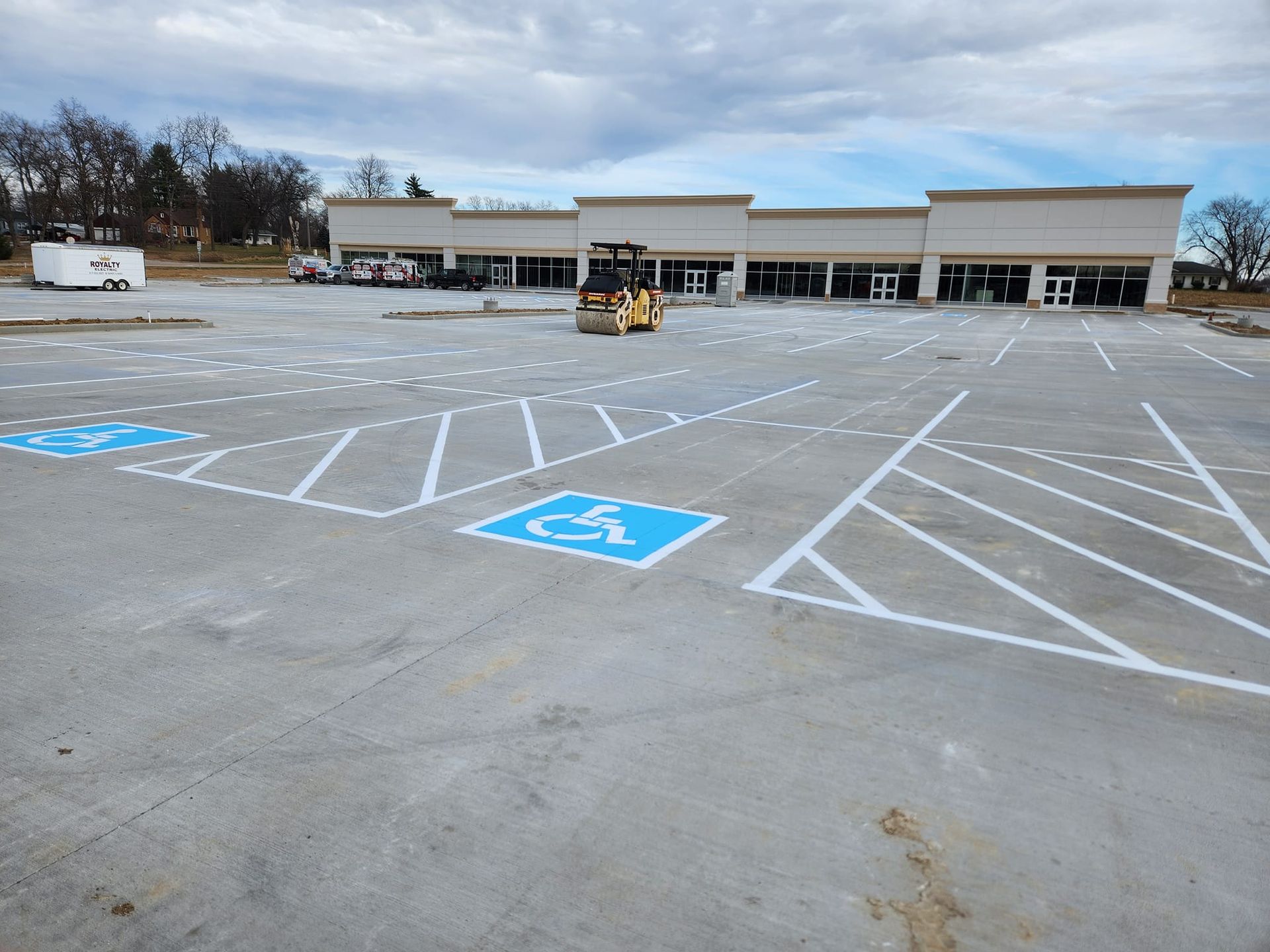 A parking lot with a handicap sign painted on it