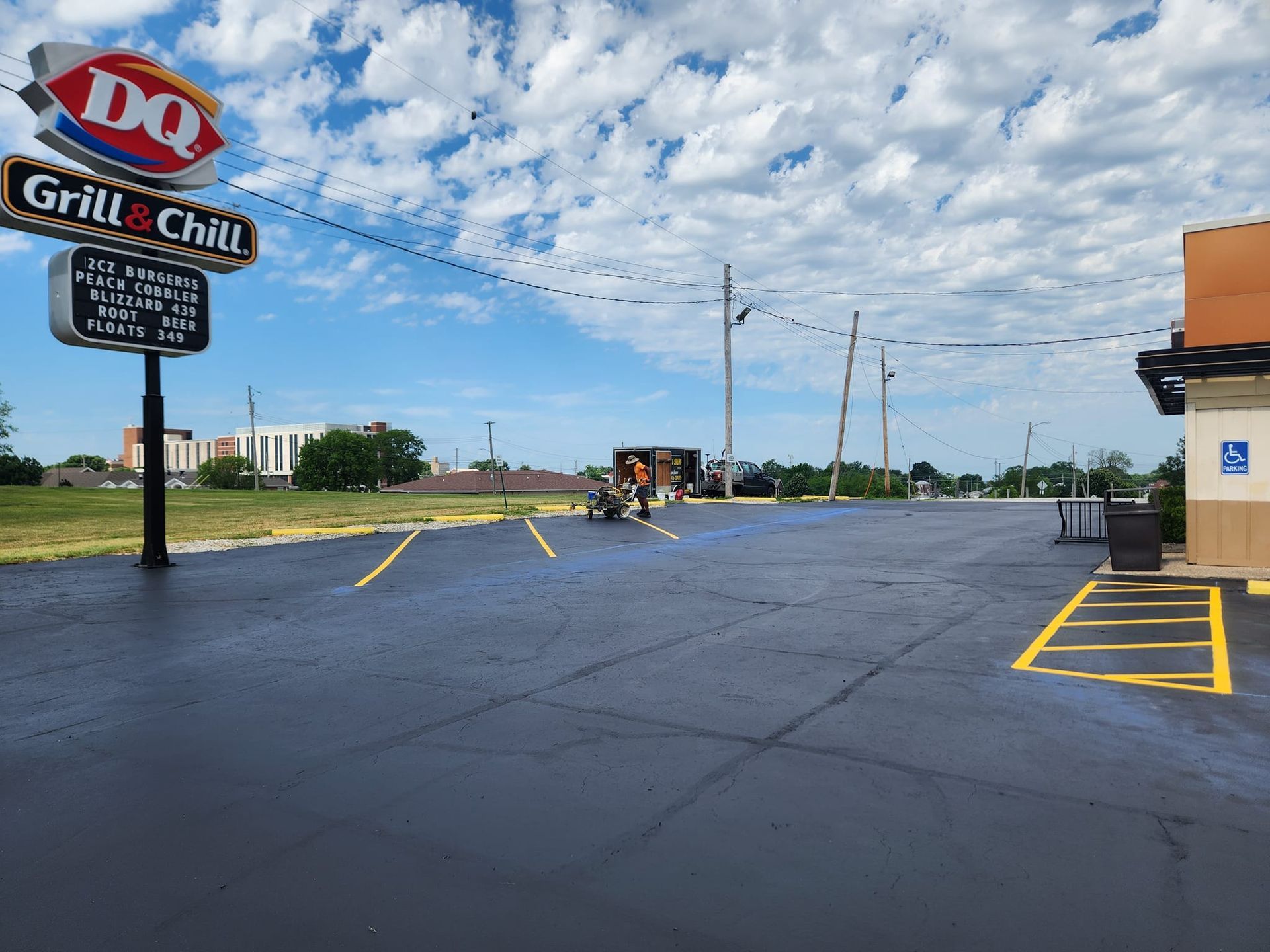 A parking lot with a sign that says dq grill & chill