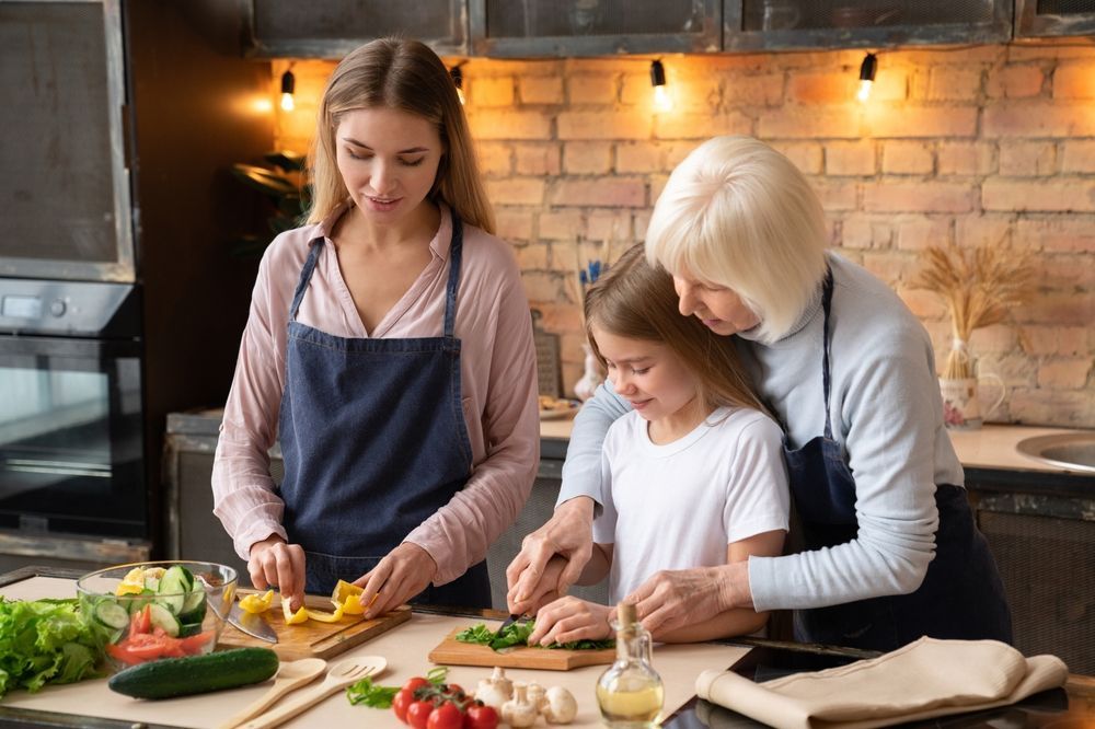 family preparing food in a beautiful kitchen, Steve's Pest Control preventative maintenance, safe food production