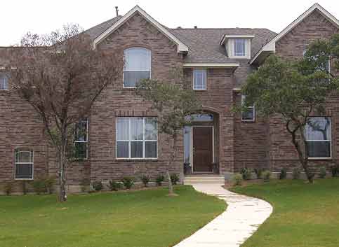 Building Supplies — Large Brick House with Bricks in Odessa, TX