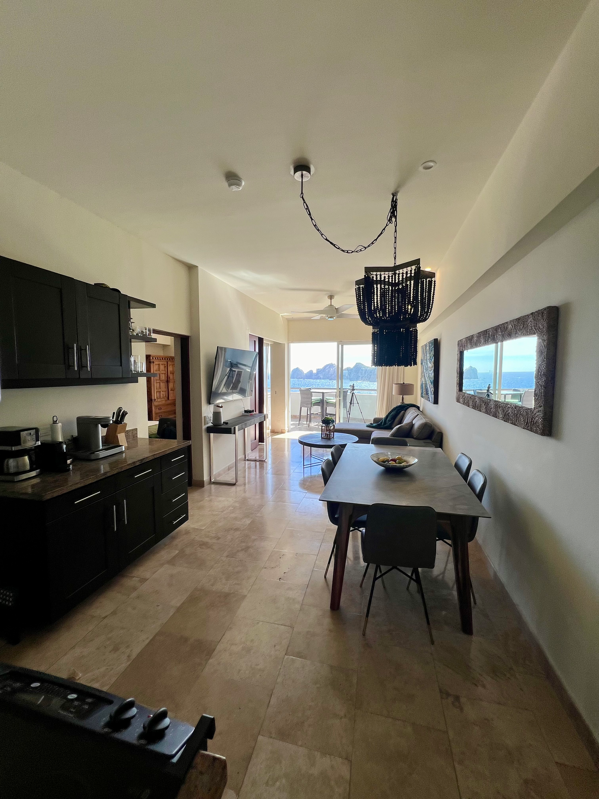 A large room with a table and chairs in it