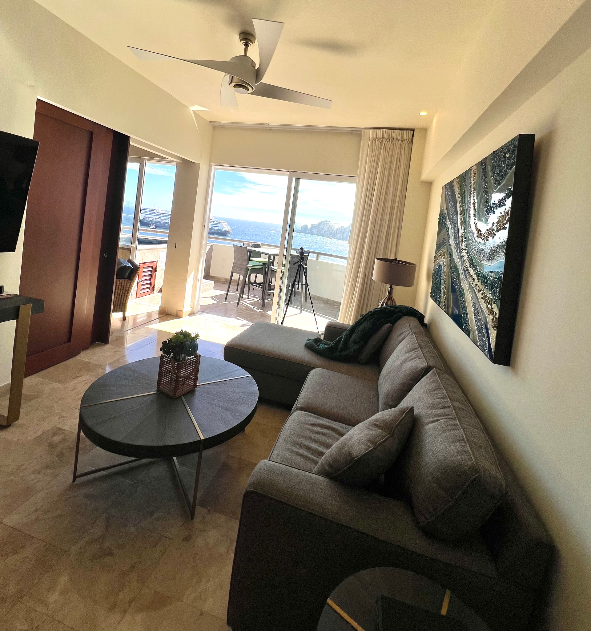 A living room with a couch and a round table