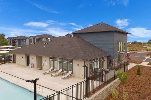 A large house with a pool in front of it