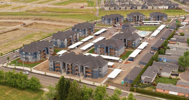 An aerial view of a residential area with lots of houses and trees.