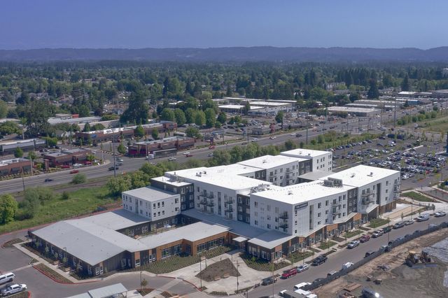 An aerial view of a large building in a city