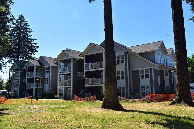 A large apartment building with a lot of windows and balconies