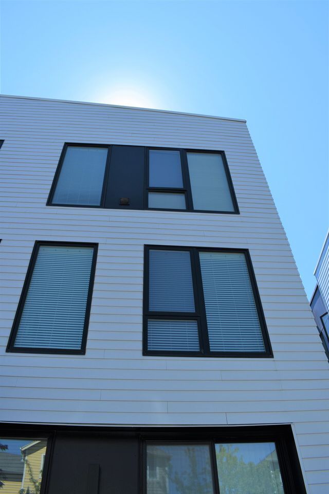 The sun is shining through the windows of a building