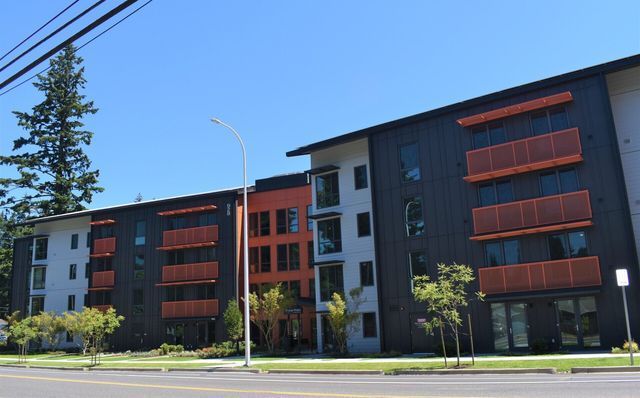 A large apartment building with a lot of windows and balconies