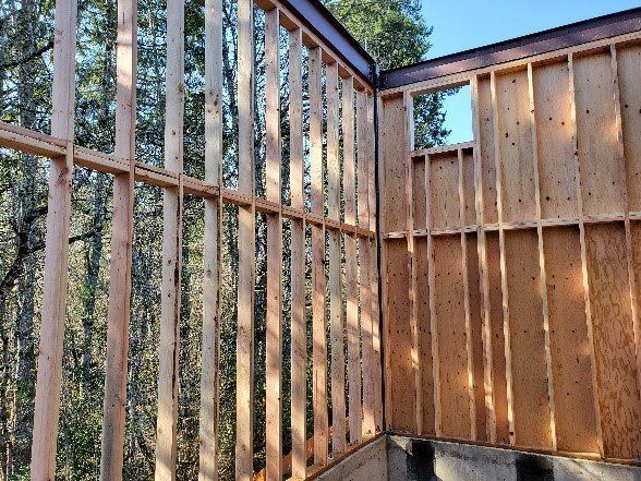 A building is being built with a lot of wooden beams