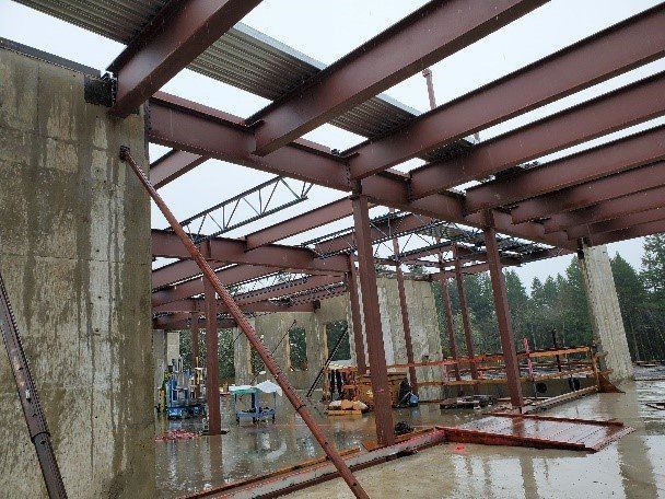 A building under construction with a lot of metal beams