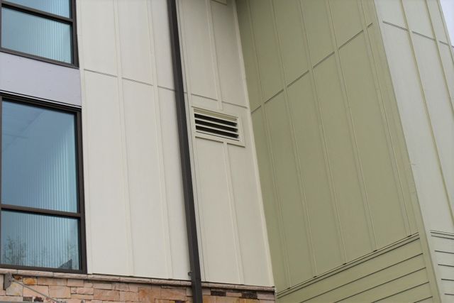 A building with a drain pipe on the side of it.