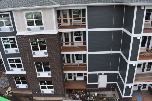 An aerial view of a large apartment building under construction