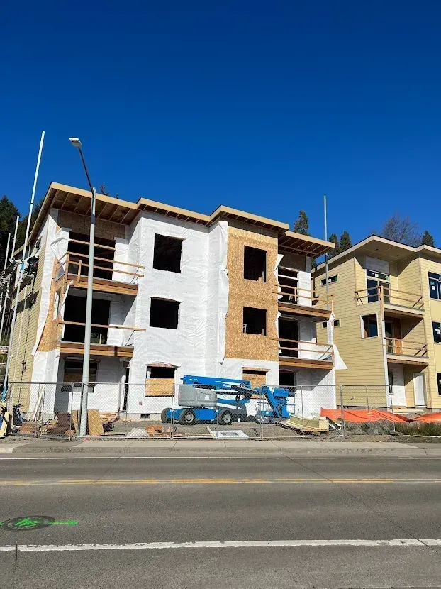 A building is being built on the side of the road.