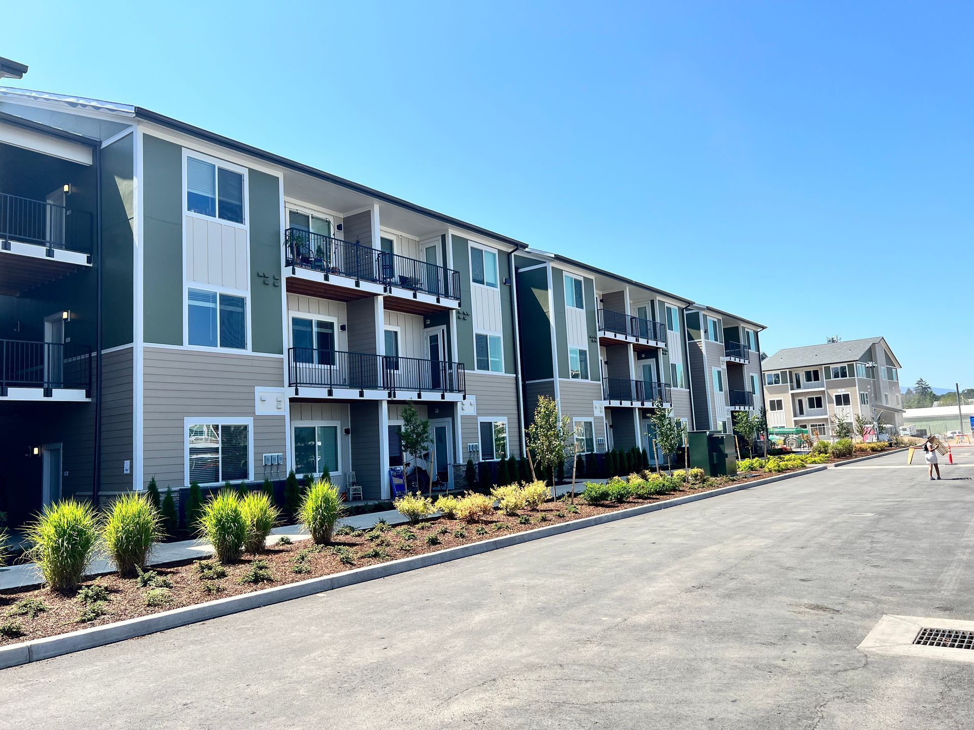 A large apartment building with a lot of windows and balconies
