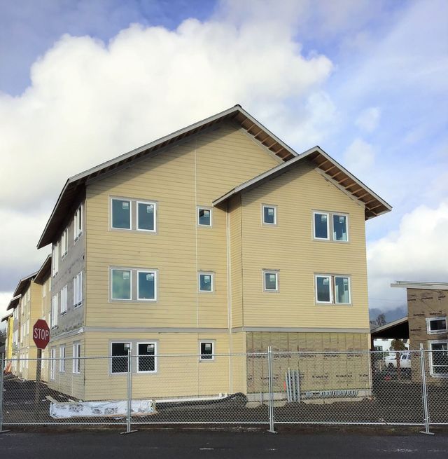 A large house with a stop sign in front of it