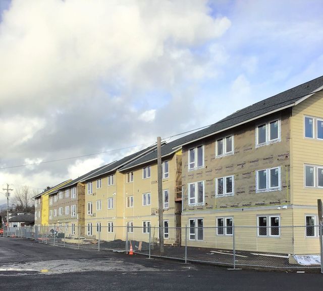 A building under construction with a lot of windows