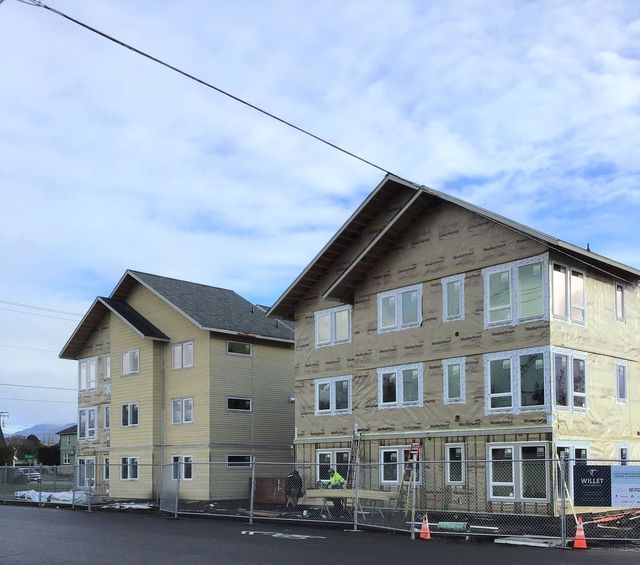 A large building under construction with a lot of windows
