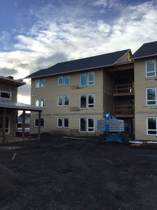 A large building with a lot of windows is being built.