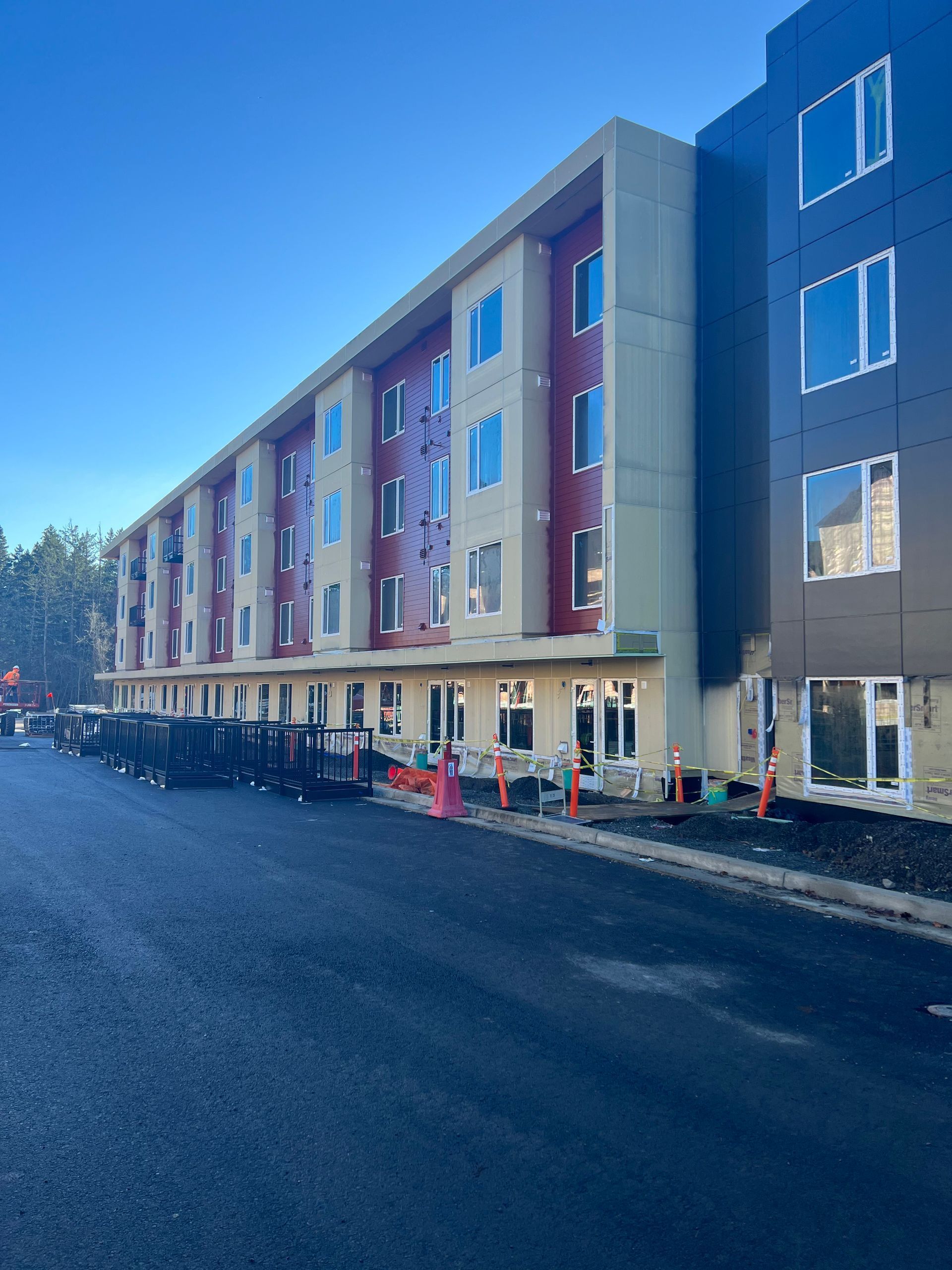 A large building with a lot of windows is under construction