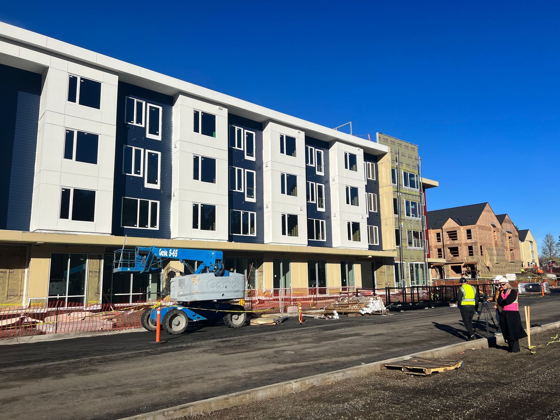 A large building is being built with a lot of windows.
