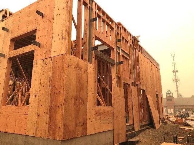 A house is being built with a lot of wood.