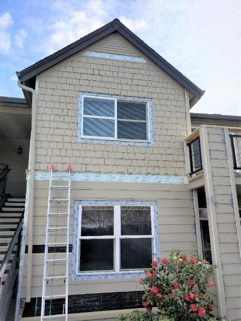 A house with a ladder on the side of it