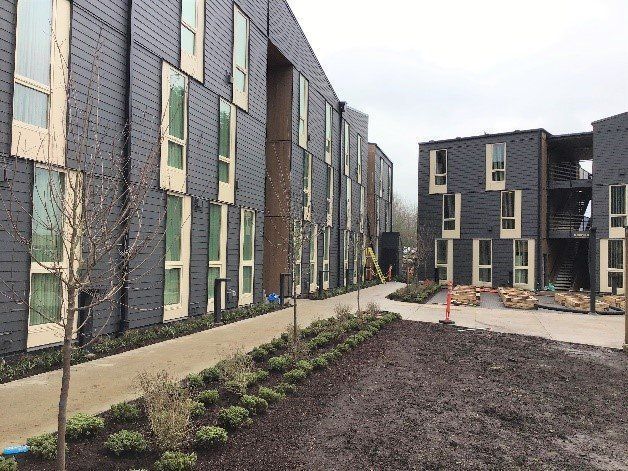 A large building with a lot of windows is being built.