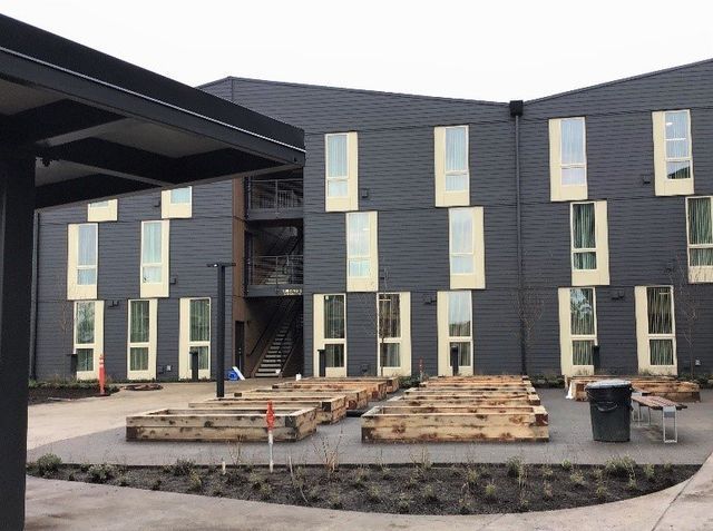 A large building with a lot of windows is being built.