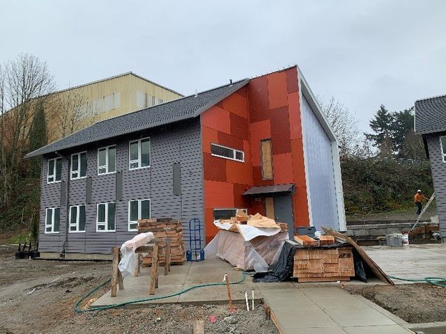 A large building with a lot of windows is being built